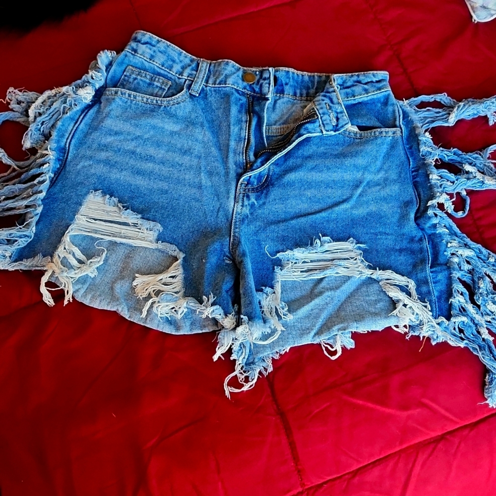 Distressed [medium wash] denim shorts